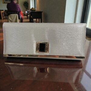 NWT Elegant Silver Clutch with Black Accent